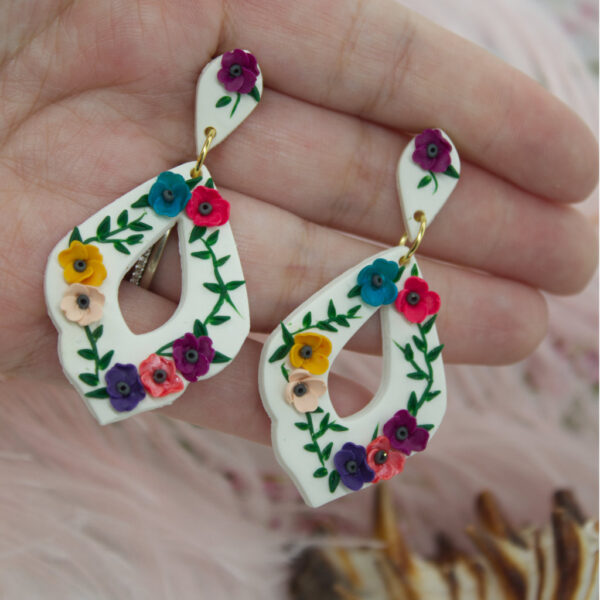 Experience the charm and sophistication of our Polymer Clay Earrings, and let their floral beauty bring a touch of nature-inspired elegance to your style. Order yours today and embrace the captivating allure of these exquisite accessories.