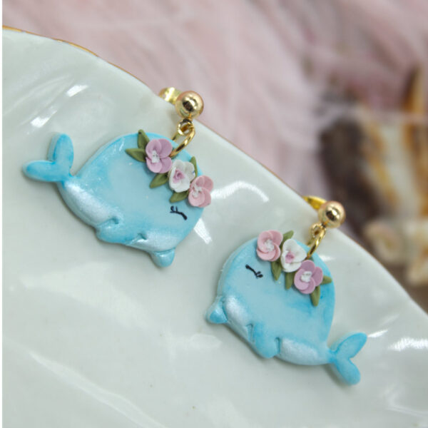 Handmade earrings crafted from polymer clay into a charming blue whale shape, an ideal accessory for a summer-themed style statement.