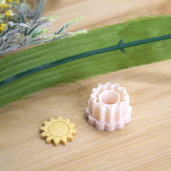 A vibrant sun-shaped polymer clay cutter, designed for creating stunning sun stud earrings with ease. Perfect addition to your collection of polymer clay cutters.