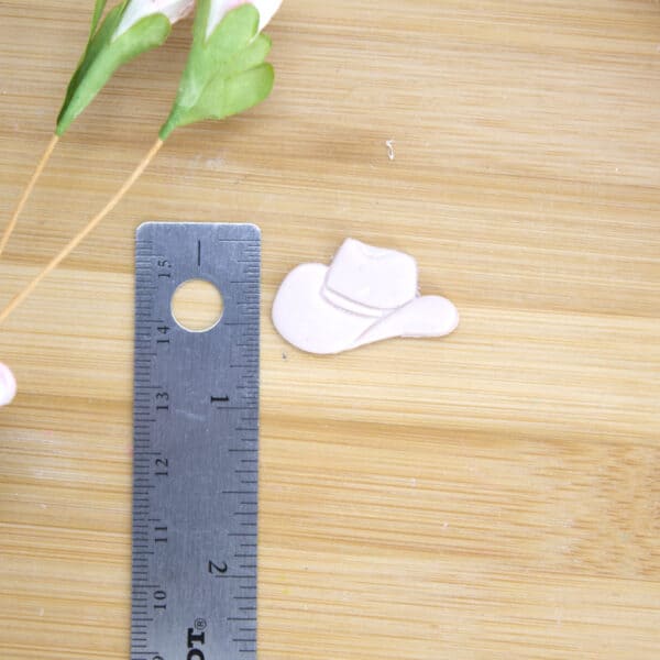 A cowboy hat-shaped clay cutter expertly designed for making one-of-a-kind polymer clay earrings, providing an easy and creative way to add a Western touch to your handmade jewelry collection using this cowboy hat cutter.