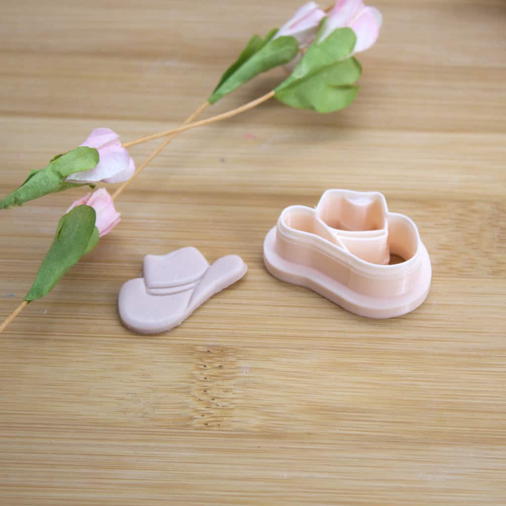 A cowgirl hat-shaped clay cutter designed for creating unique polymer clay earrings, perfect for adding a touch of Western flair to your handmade jewelry collection.