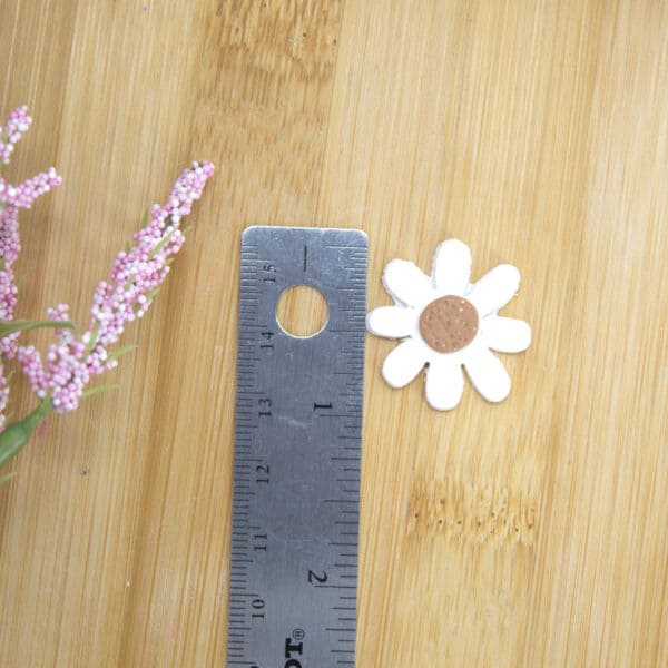 Elegant daisy-shaped clay cutter for crafting intricate polymer clay earrings with a floral touch