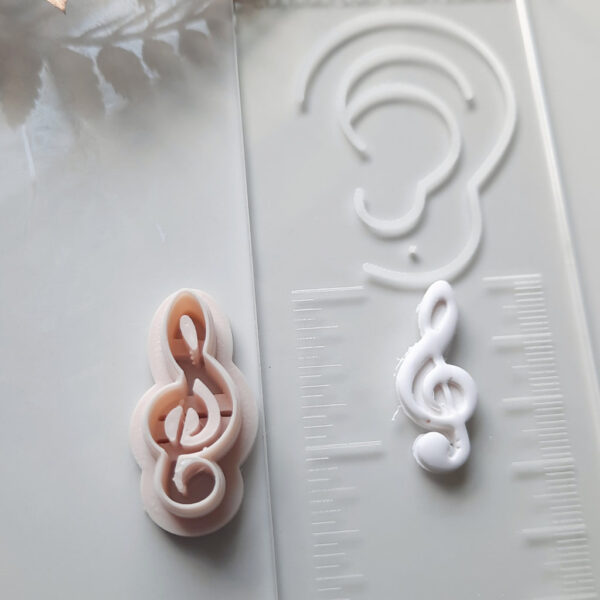 Music clay cutter used in the creation of melodic-themed polymer earrings