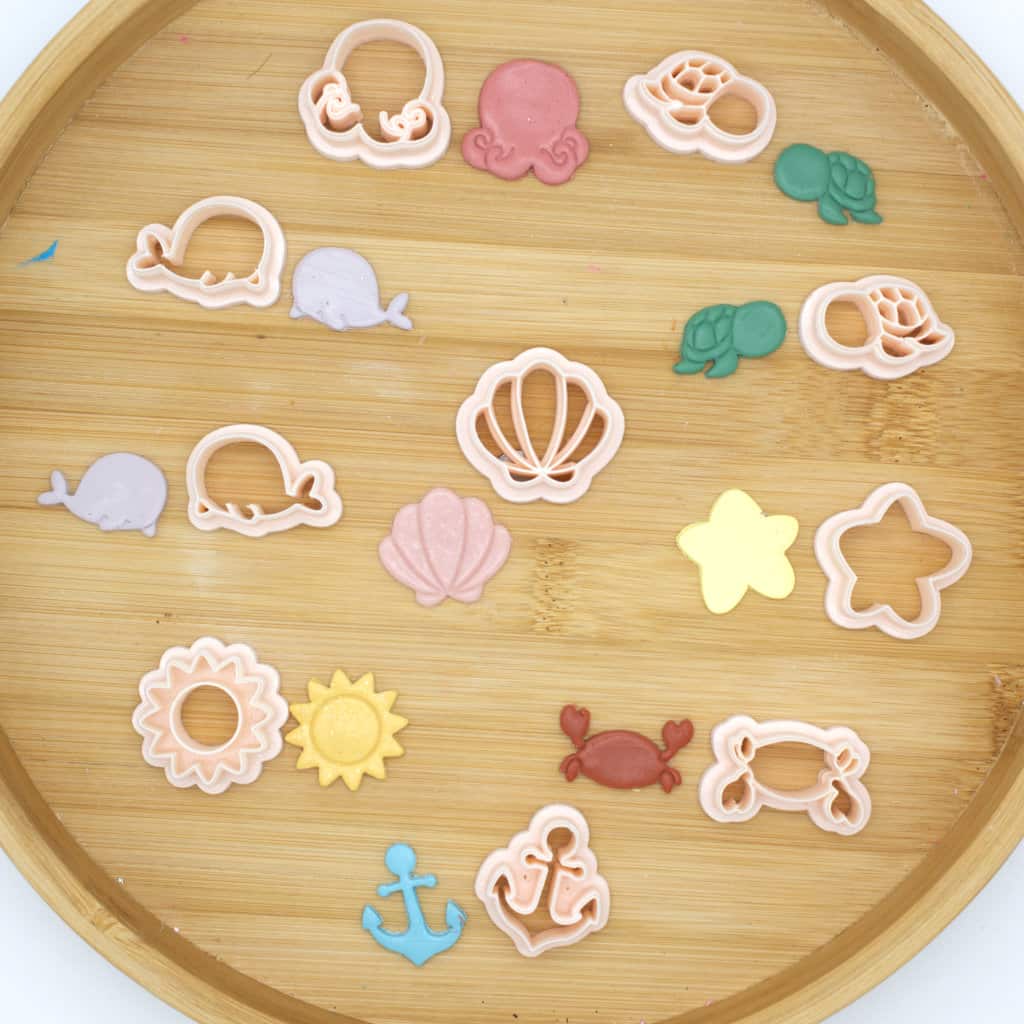 A clay cutter bundle featuring 10 summer-themed pieces designed to create vibrant polymer clay earrings inspired by the warm and sunny season.