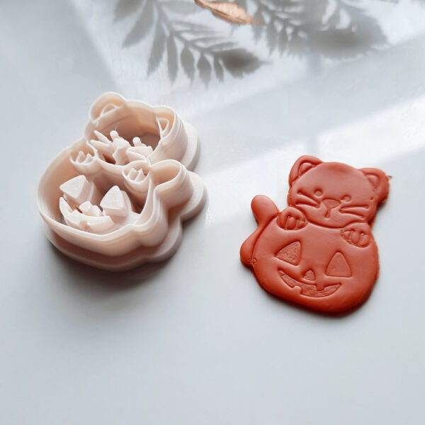 Fall clay cutters in the shape of a cat on a pumpkin, perfect for creating Halloween-themed polymer clay earrings