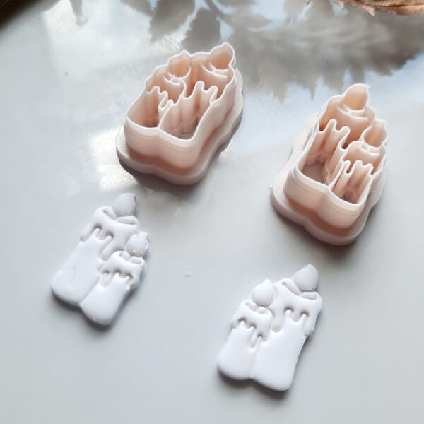 Image of a unique candle-shaped Halloween clay cutter, perfect for creating fall-themed polymer clay earrings and other festive crafts.