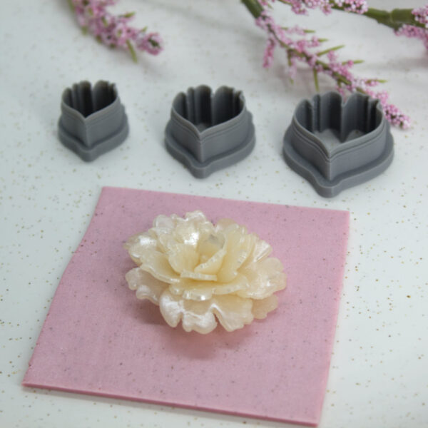 A detailed view of a clay cutter with a distinctive petal shape, a vital tool for crafting handmade polymer clay earrings