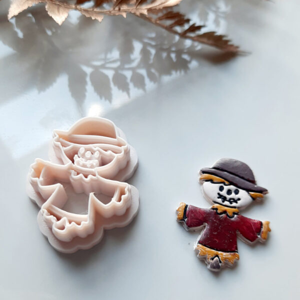 A creatively designed scarecrow polymer clay cutter, perfect for making Halloween-themed earrings.