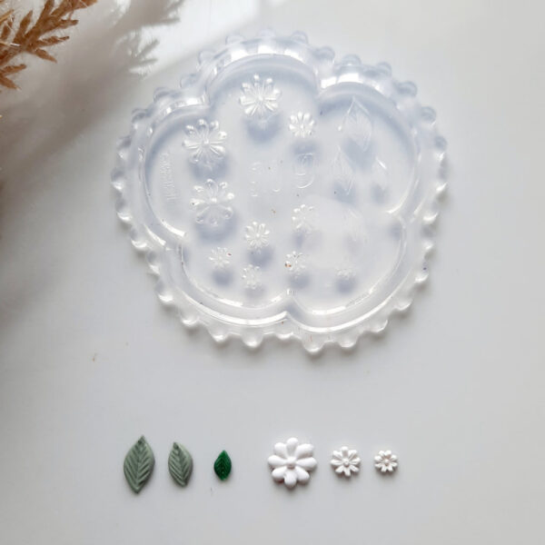 Silicon mold perfect for creating intricate polymer clay designs of tiny flowers and foliage.