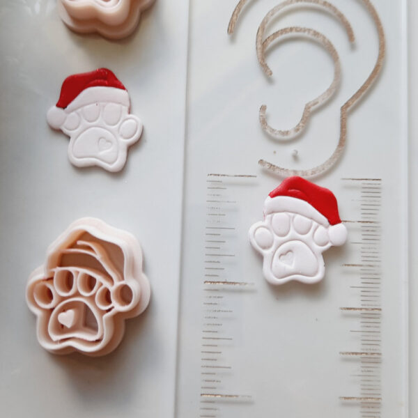 Christmas-themed dog paw clay cutter, ideal for creating festive polymer clay earrings.