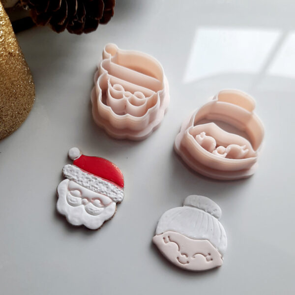 Santa clay cutter alongside Mrs. Claus cutter, a delightful duo for making Christmas-themed polymer clay earrings.