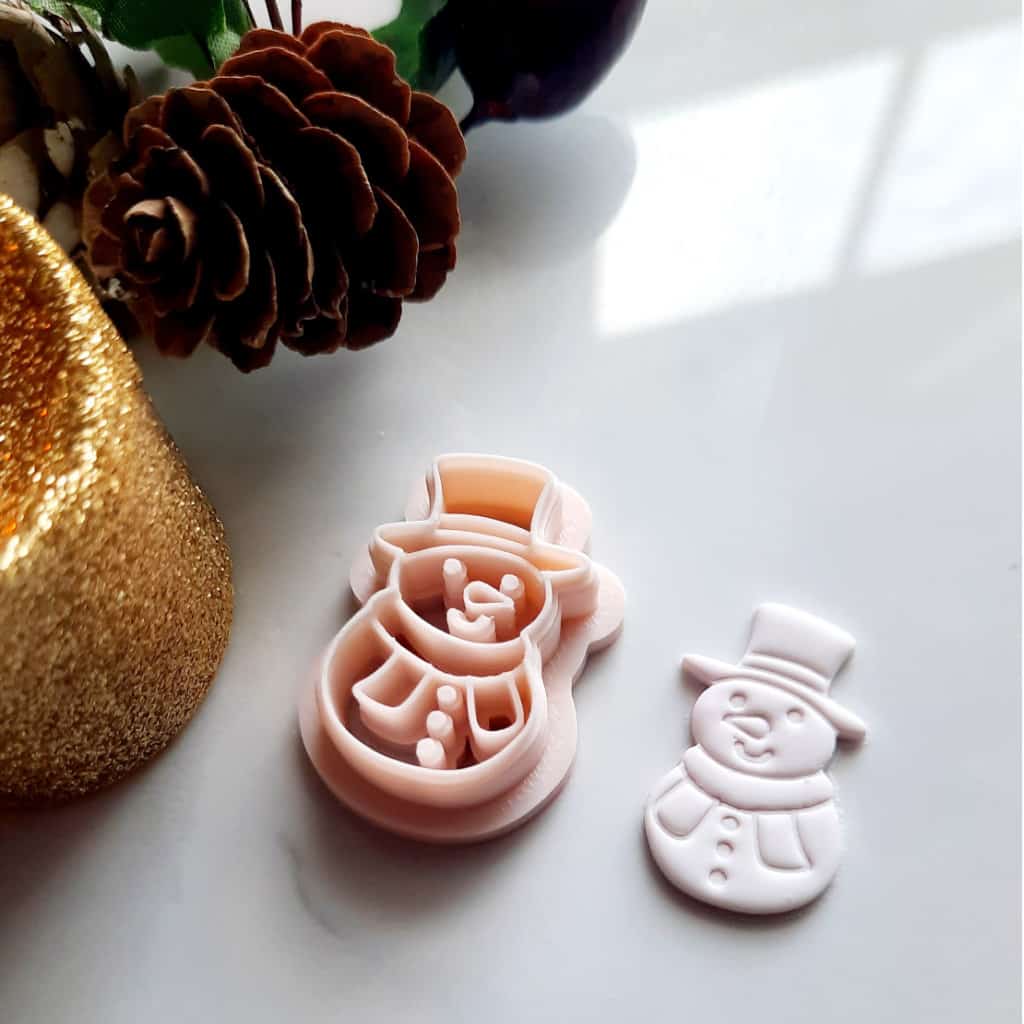 A snowman-shaped polymer clay cutter, perfect for creating Christmas-themed earrings