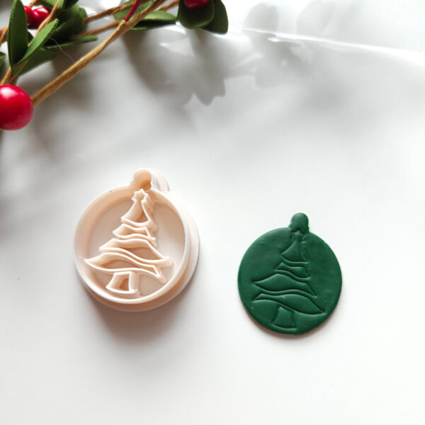 "Polymer clay cutter designed as a Christmas tree ornament for crafting festive handmade earrings.