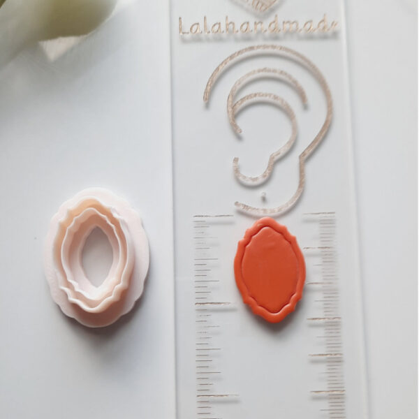 Crafting tool: Polymer clay cutter with a mirror frame shape for making bespoke earrings.