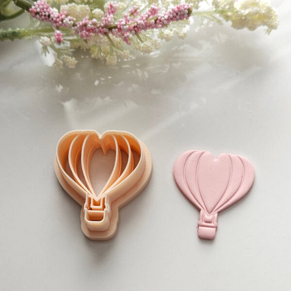 Polymer clay cutter in a hot air balloon shape, ideal for DIY Valentine's Day earring projects.