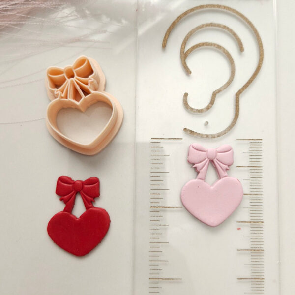 Celebrate love with this heart and bow polymer clay cutter for Valentine's Day-themed earrings