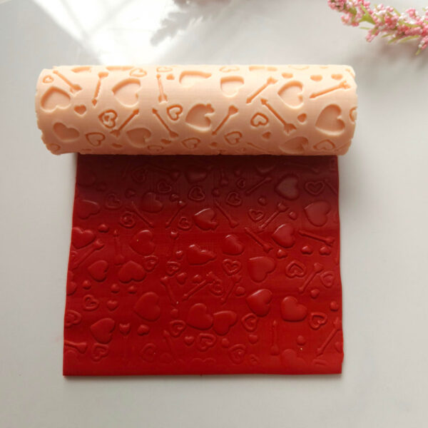 Texture roller featuring love-inspired designs for Valentine's Day polymer clay earring projects