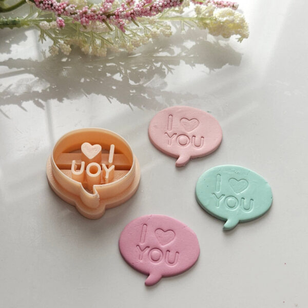 Polymer clay cutter shaped as bubble text saying 'I Love You', perfect for creating Valentine's themed earrings.